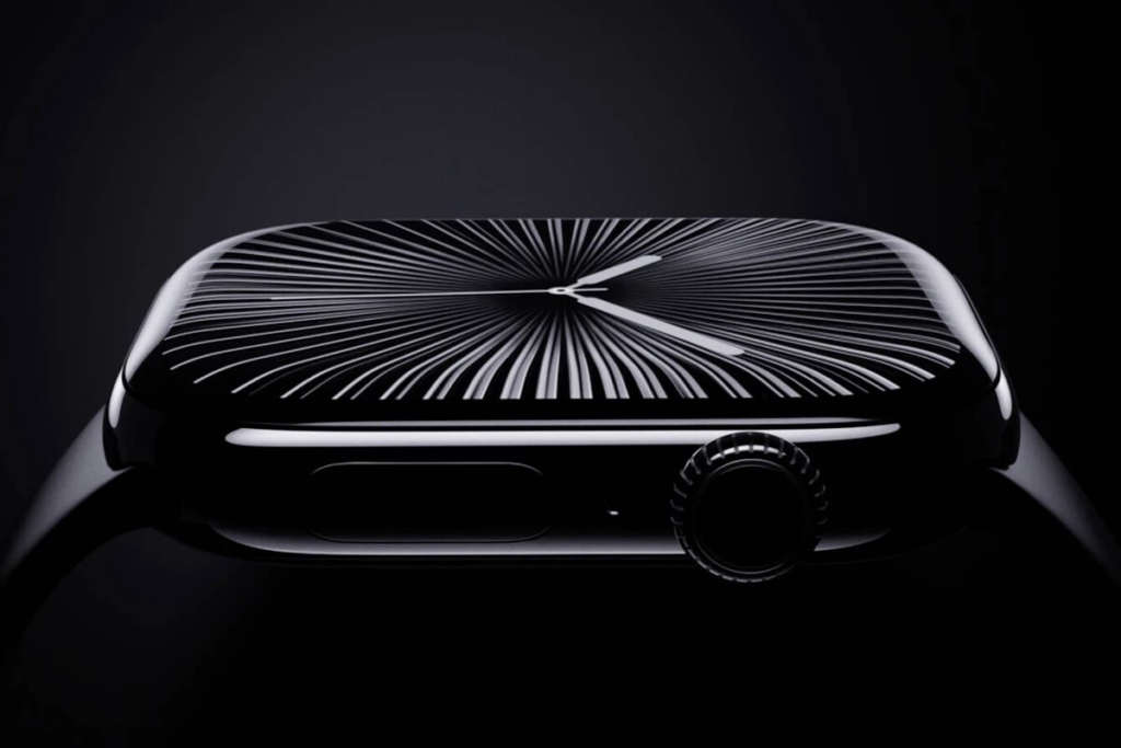 Un reloj con manecillas, de color negro y un fondo negro.